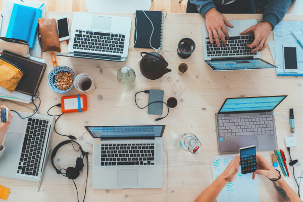 People collaborating on a tech project